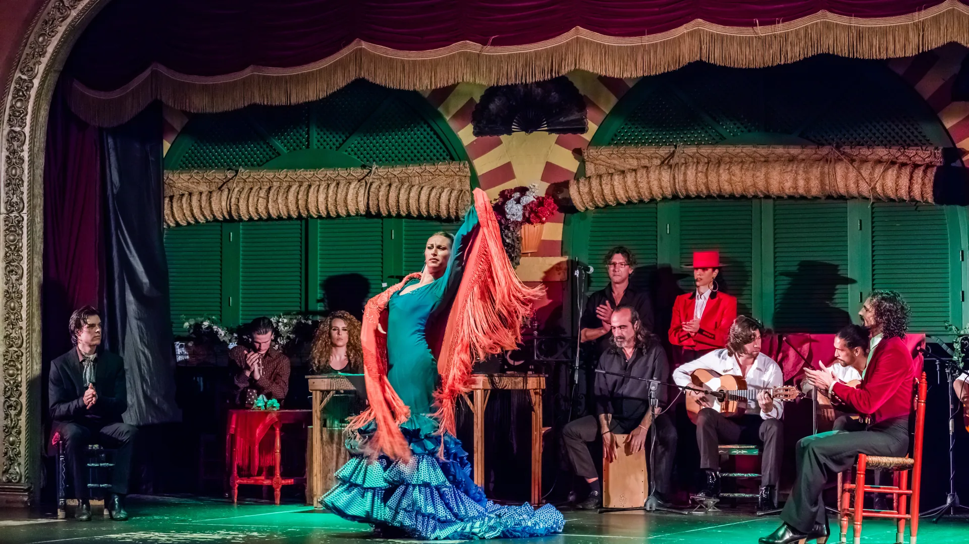 Flamenco performers on a tablao stage in Seville